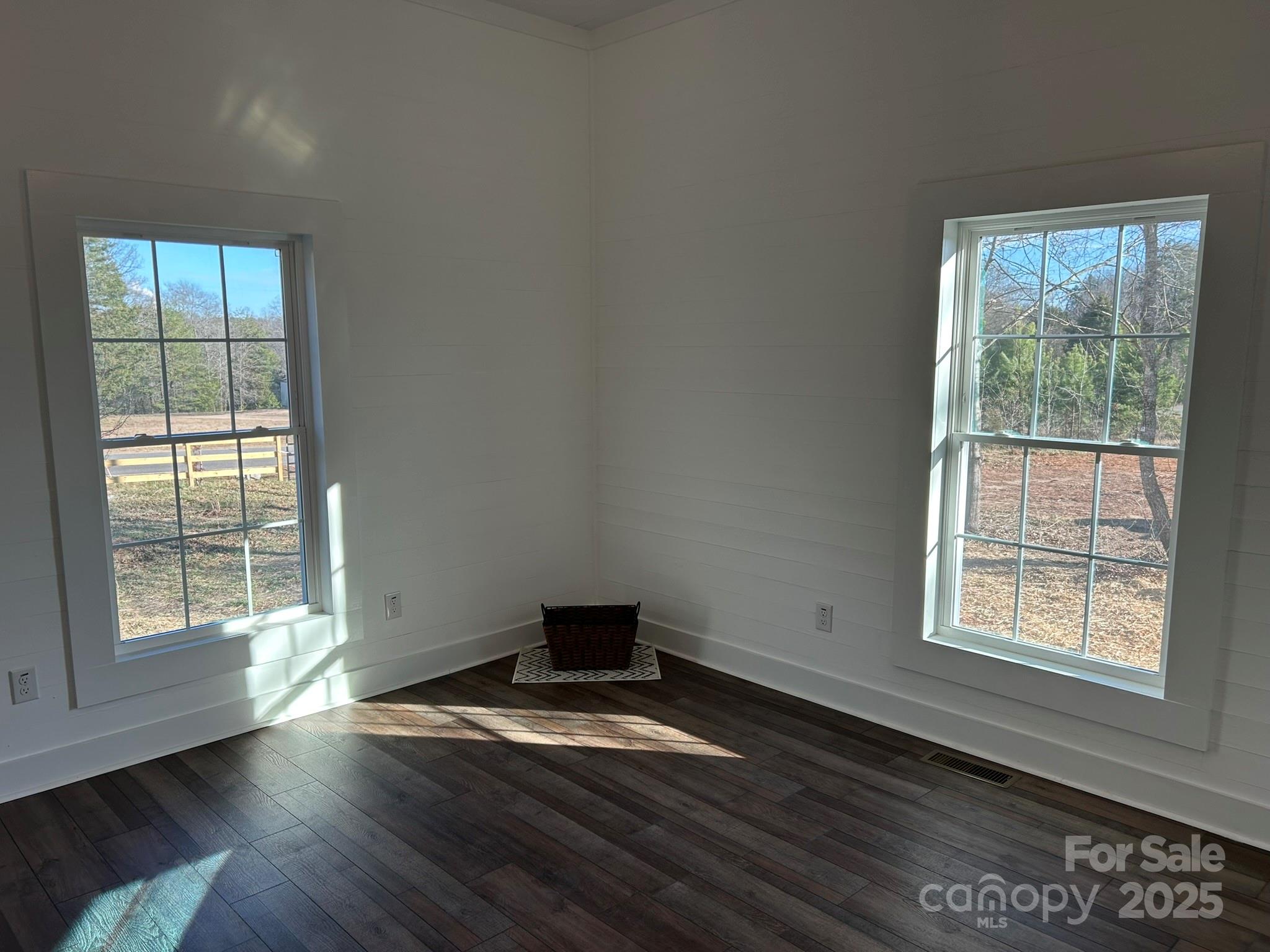 464 Hamrick Road Mooresboro, NC 28114 - Photo 37 of 48 an empty room with wooden floor and windows