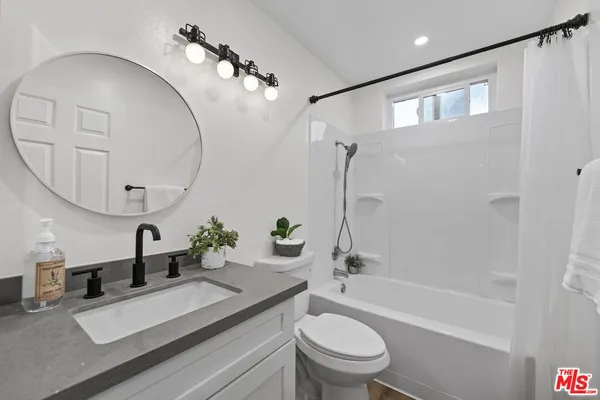 a bathroom with a shower and a bathtub