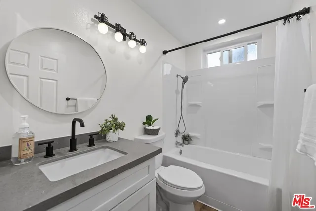 a bathroom with a shower and a bathtub