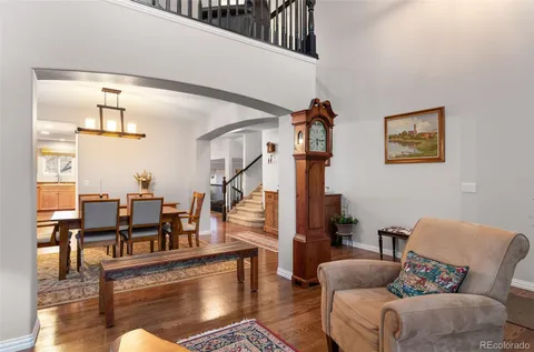 a living room with fireplace furniture and a potted plant