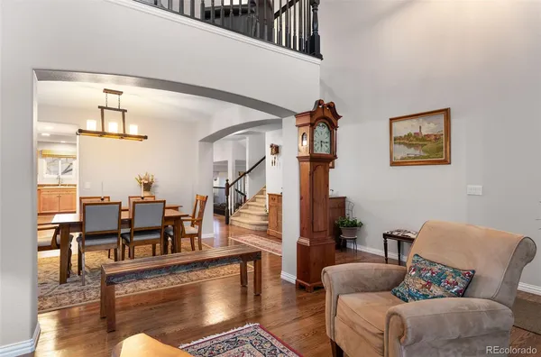 a living room with fireplace furniture and a potted plant