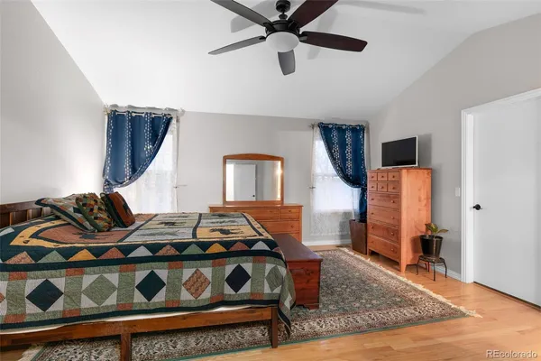 a bedroom with a bed and a dresser