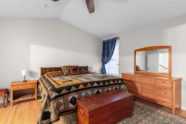 a bed room with a bed and a television