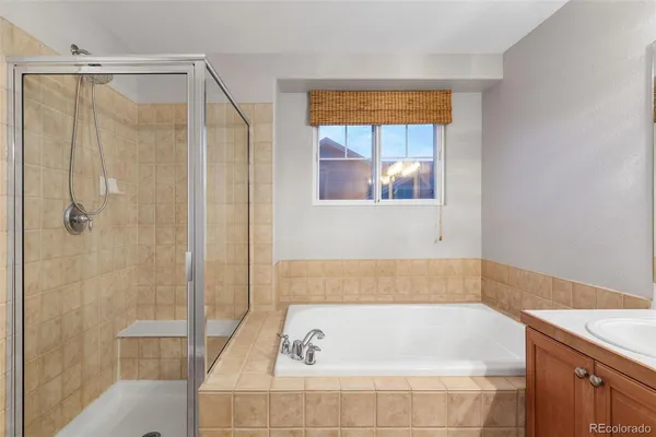 a bathroom with a bathtub and a shower