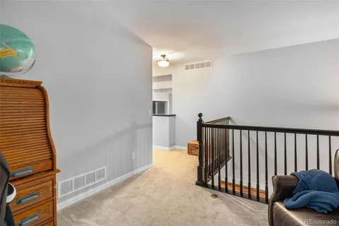 a view of a hallway with staircase