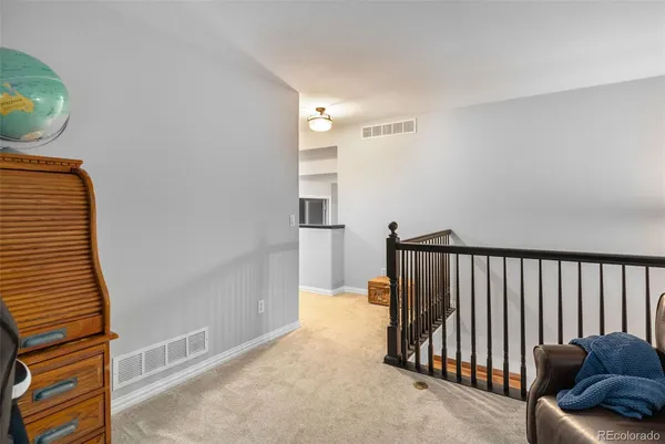 a view of a hallway with staircase