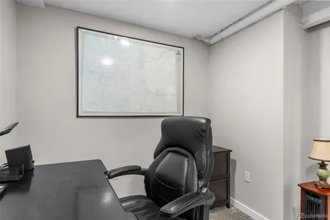 a chair sitting in a room next to a window