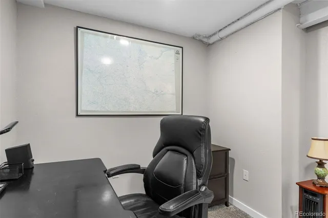 a chair sitting in a room next to a window