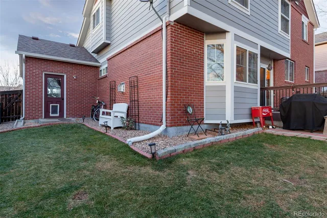 a backyard of a house with seating space