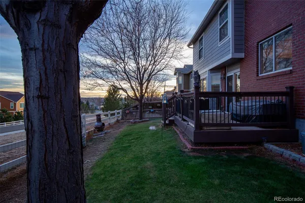 a view of a deck with a backyard