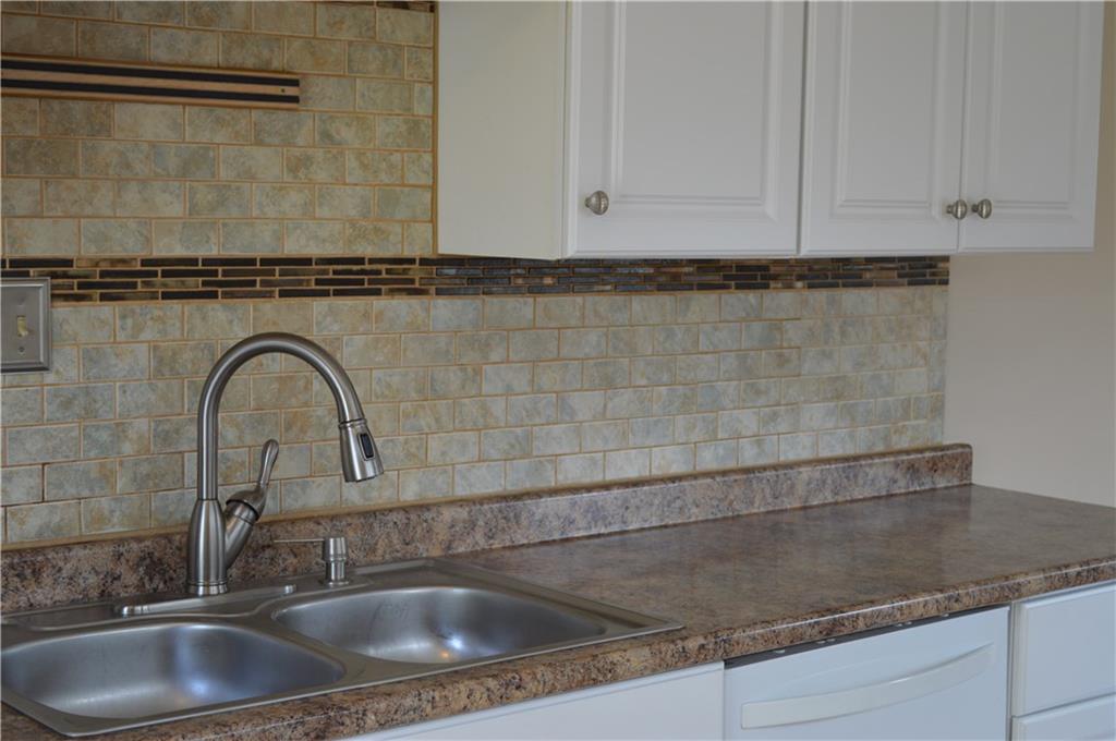 617 Jefferson Road Penn Hills, PA 15235 - Photo 2 of 20 Neutral colors in kitchen, including back splash.
