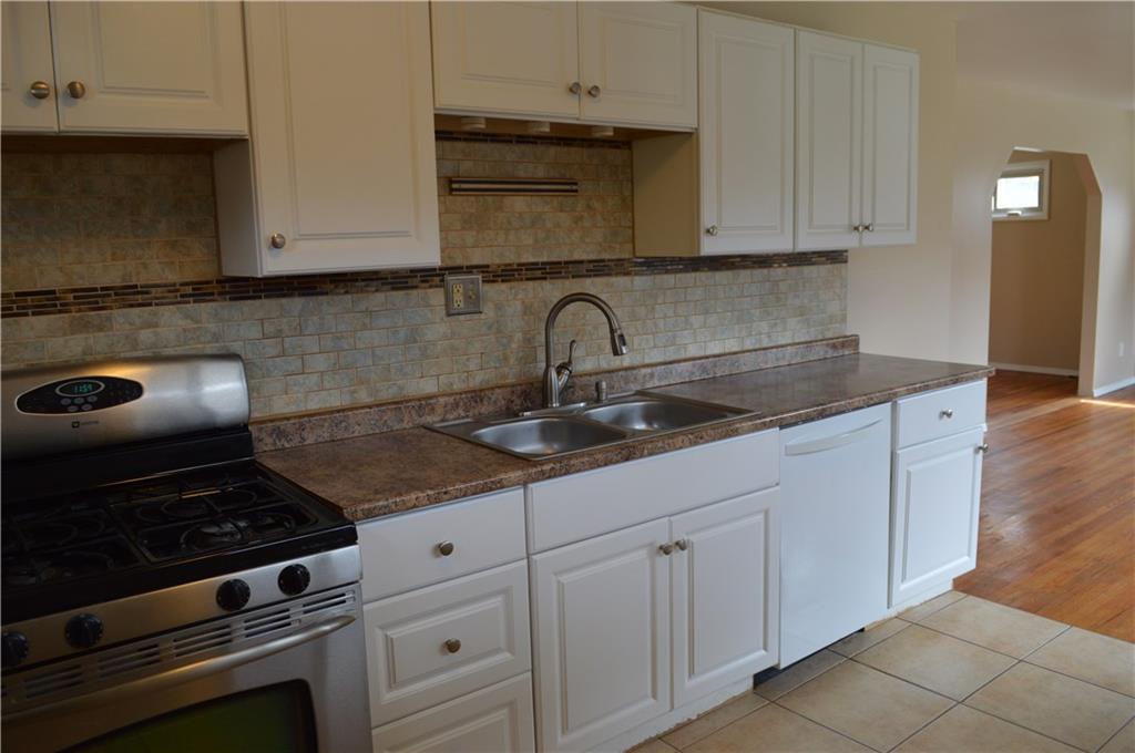 617 Jefferson Road Penn Hills, PA 15235 - Photo 3 of 20 Open concept kitchen with stainless steel gas range.