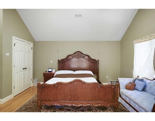 930 Main Street Hingham, MA 02043 - Photo 13 of 30 a bedroom with a bed and wooden floor