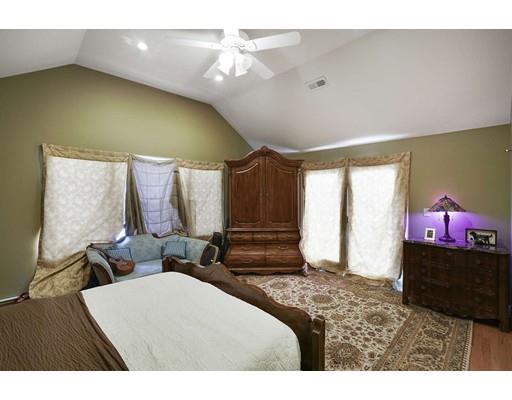 930 Main Street Hingham, MA 02043 - Photo 14 of 30 a bedroom with a bed and dresser with mirror