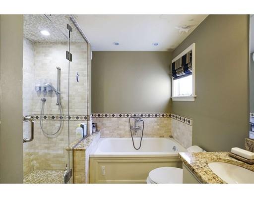 930 Main Street Hingham, MA 02043 - Photo 17 of 30 a bathroom with a sink and a mirror