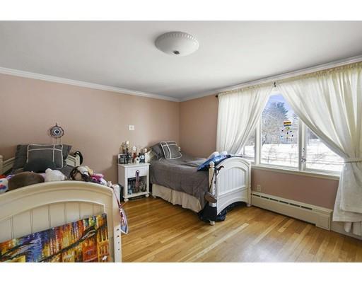 930 Main Street Hingham, MA 02043 - Photo 22 of 30 a bedroom with bed and a large window