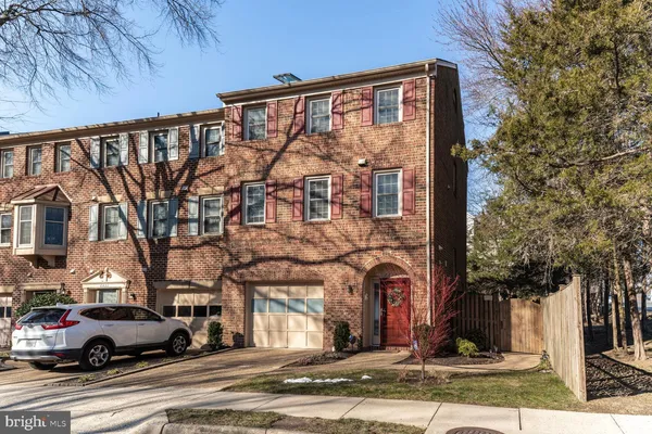 a front view of a building with parking