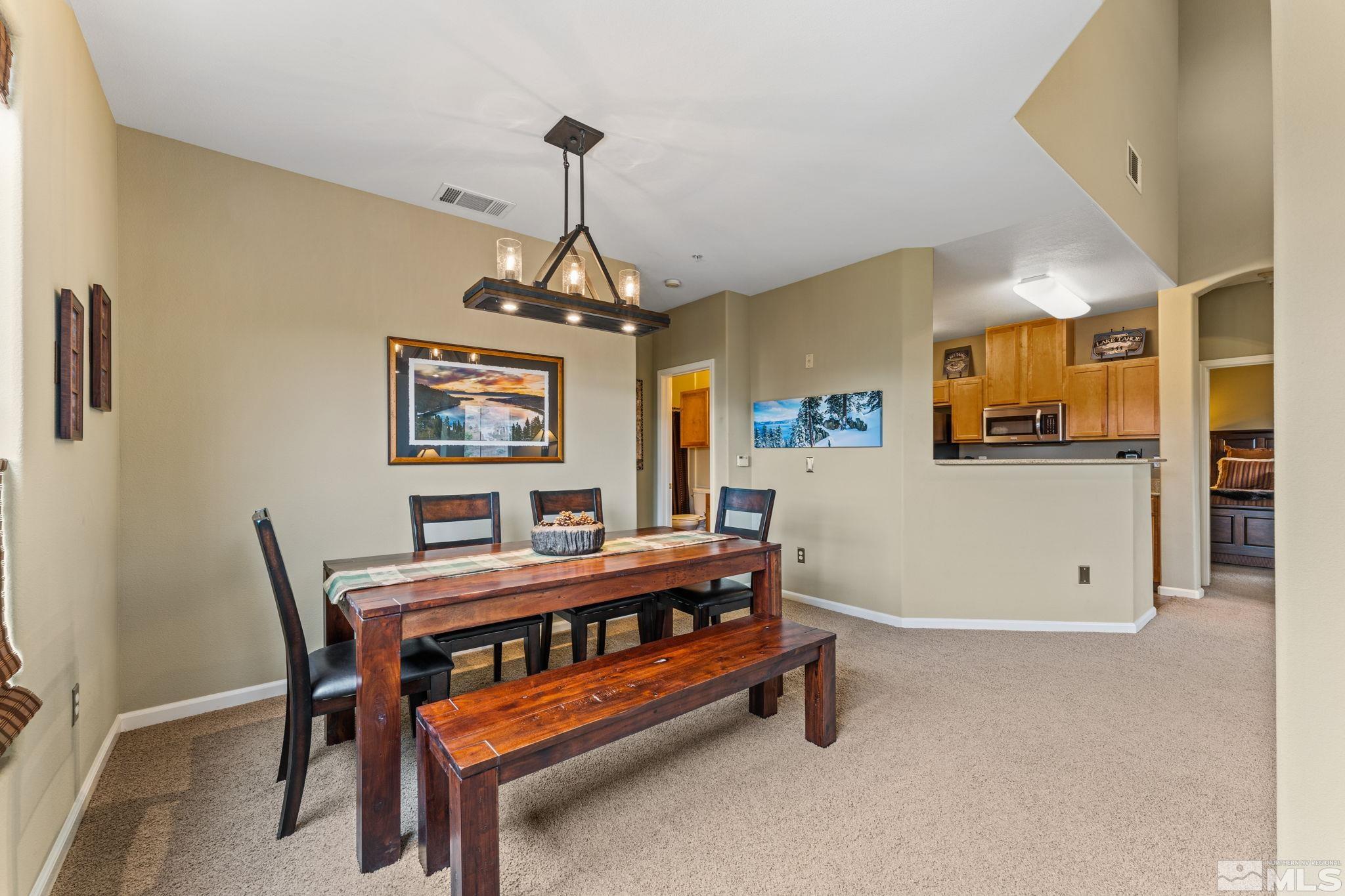 9050 Double R Boulevard, Unit 921 Reno, NV 89521 - Photo 15 of 39 a bedroom with furniture and a window