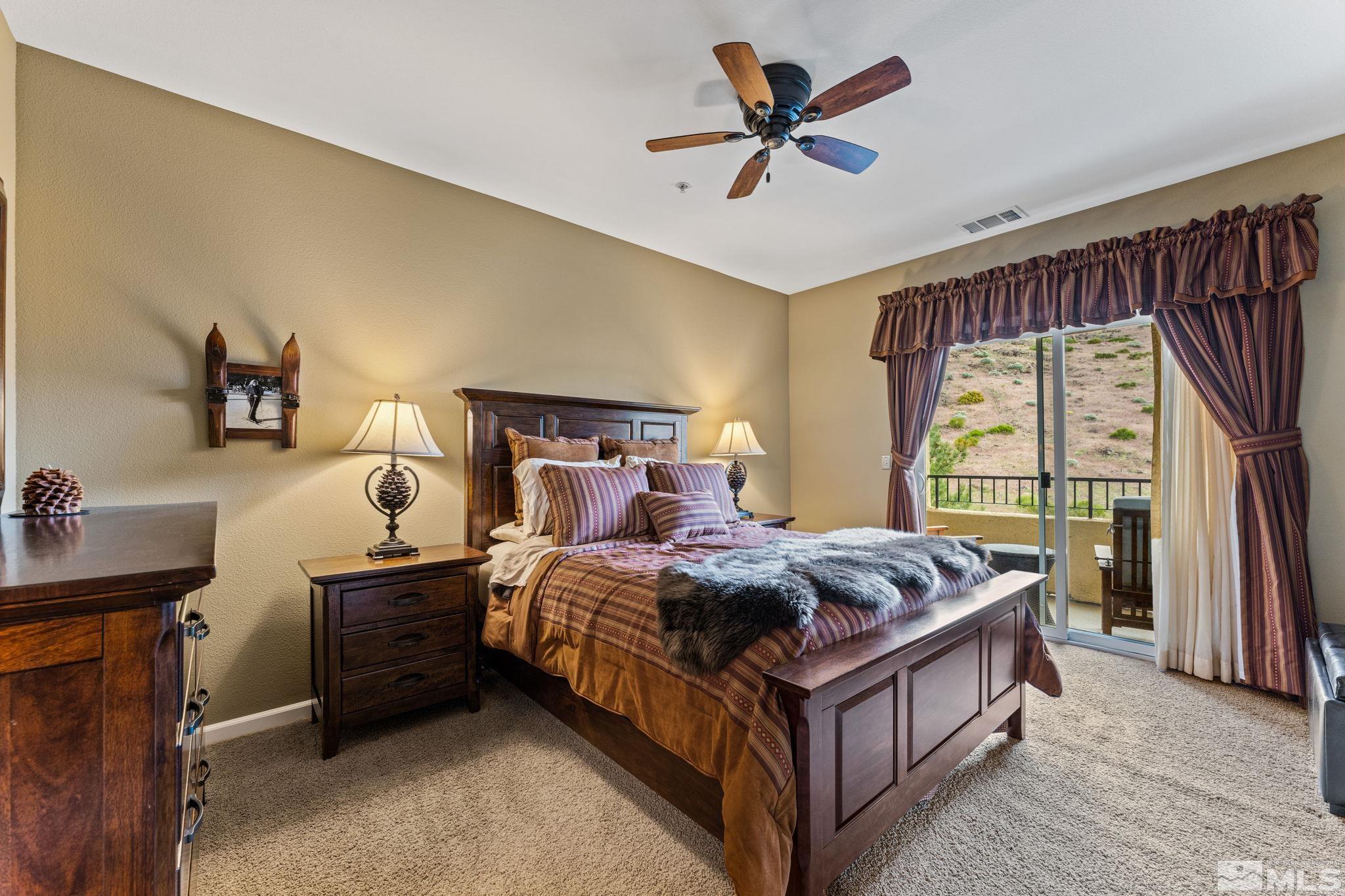 9050 Double R Boulevard, Unit 921 Reno, NV 89521 - Photo 23 of 39 a bed room with a bed and a window