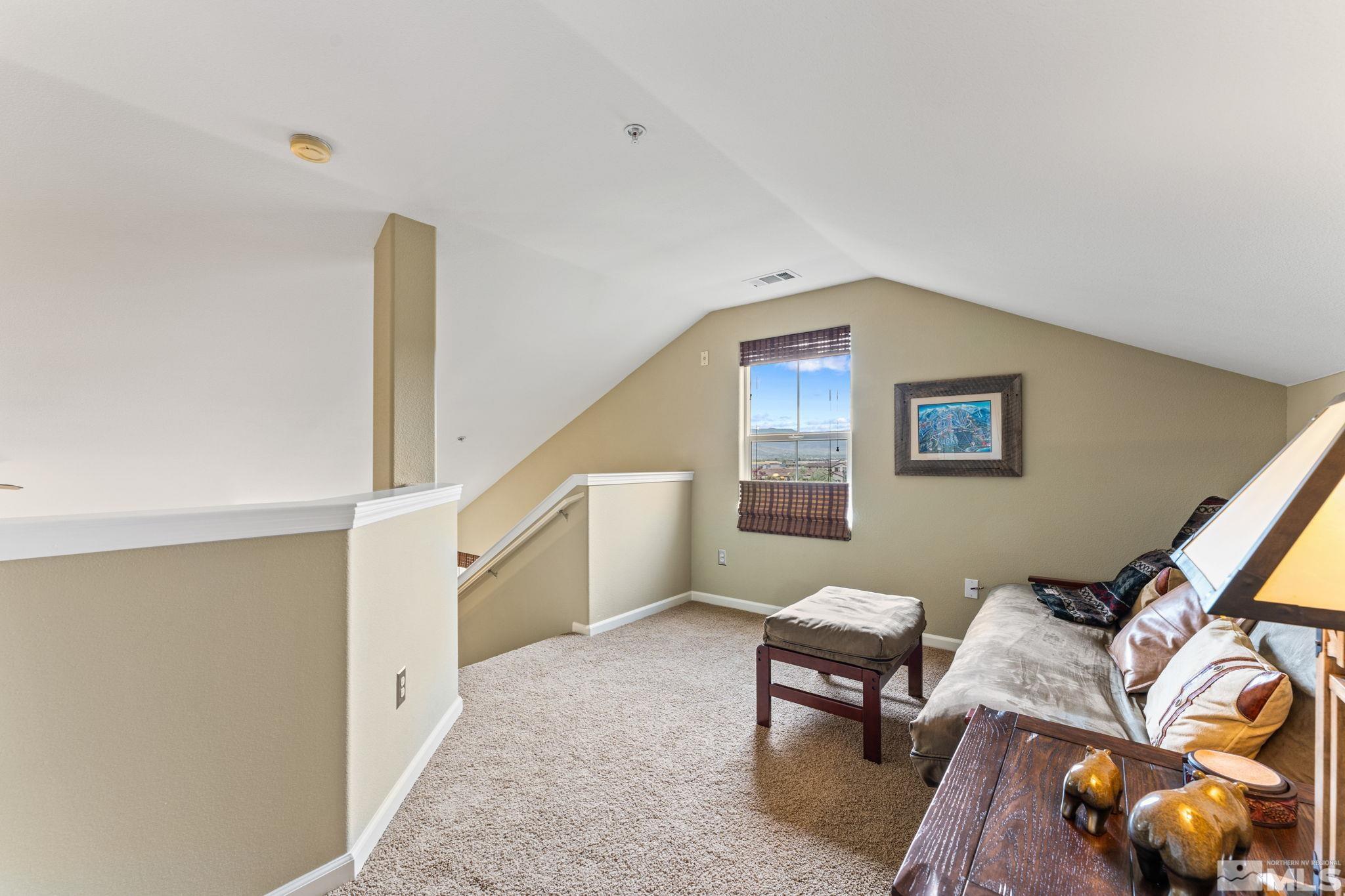 9050 Double R Boulevard, Unit 921 Reno, NV 89521 - Photo 29 of 39 a living room with furniture and a wooden floor