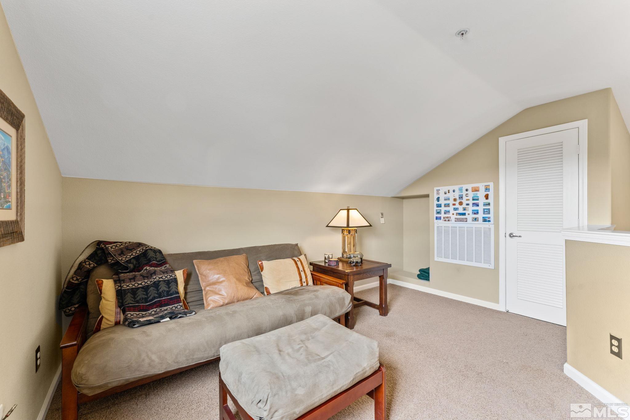 9050 Double R Boulevard, Unit 921 Reno, NV 89521 - Photo 30 of 39 a living room with furniture and a gym machine