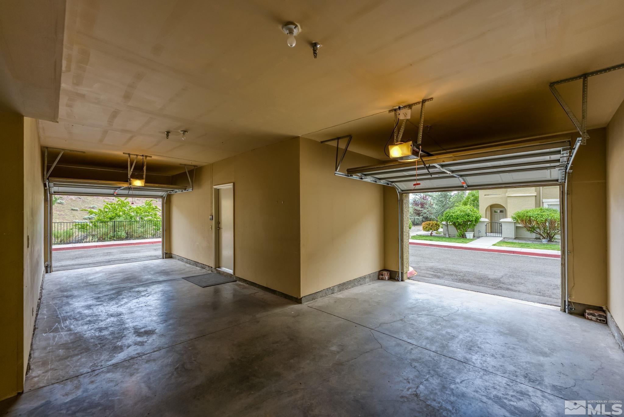 9050 Double R Boulevard, Unit 921 Reno, NV 89521 - Photo 35 of 39 a view of a hallway with wooden floor and windows