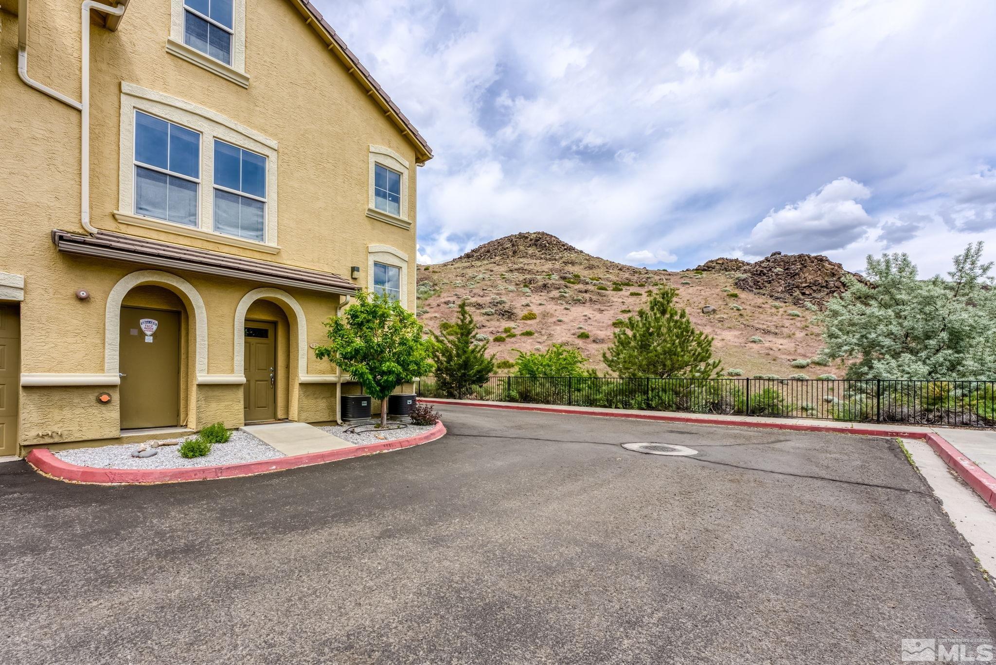 9050 Double R Boulevard, Unit 921 Reno, NV 89521 - Photo 4 of 39 a view of a house with sitting area and garden