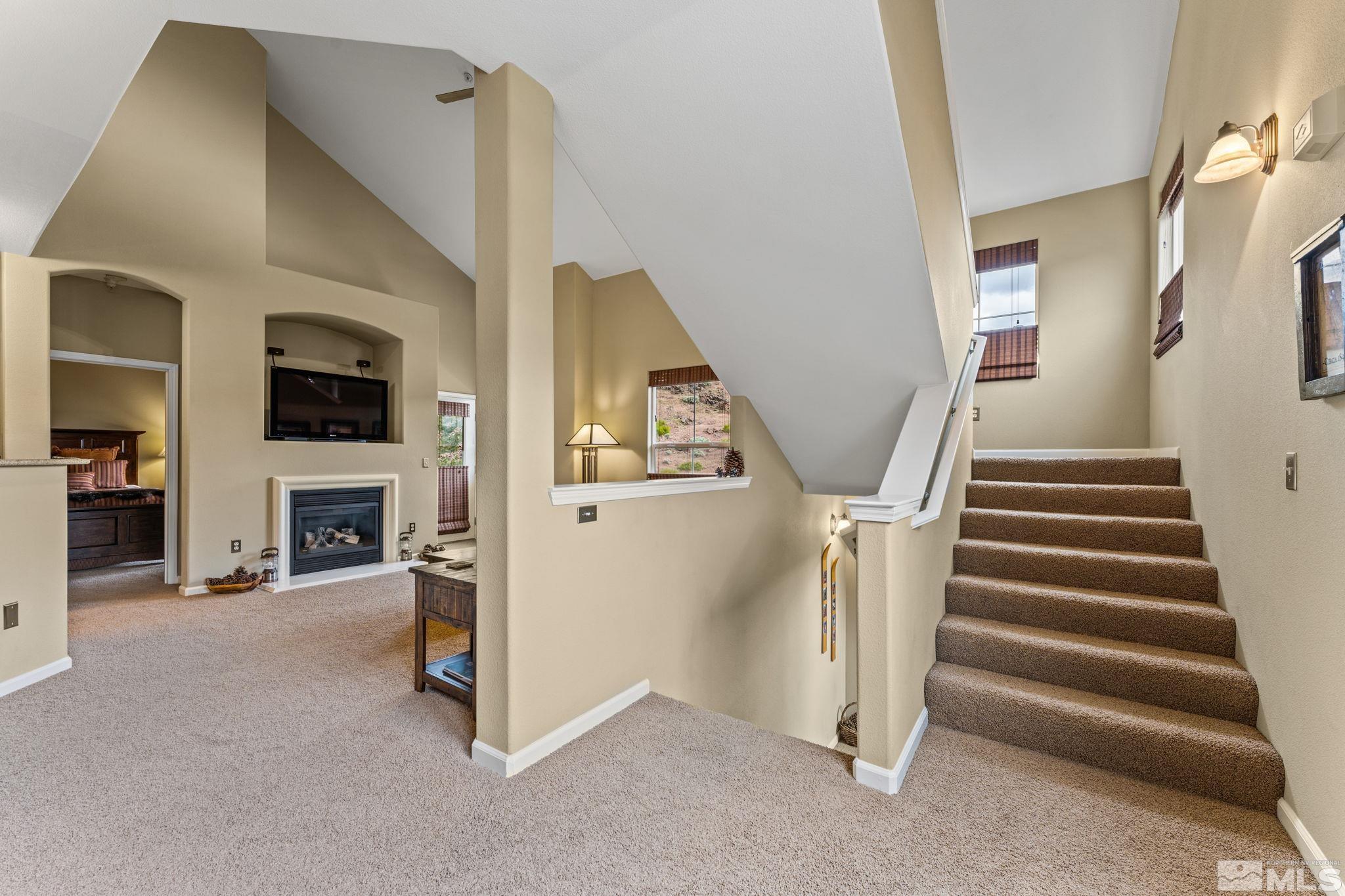 9050 Double R Boulevard, Unit 921 Reno, NV 89521 - Photo 9 of 39 a view of a livingroom with a fireplace