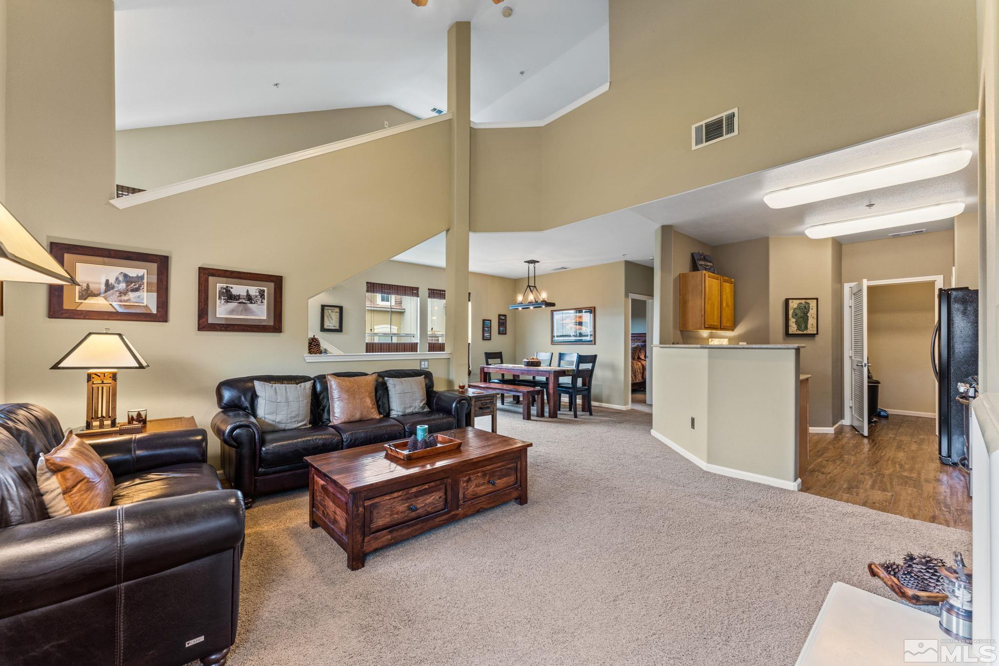 9050 Double R Boulevard, Unit 921 Reno, NV 89521 - Photo 10 of 39 a living room with furniture and kitchen view