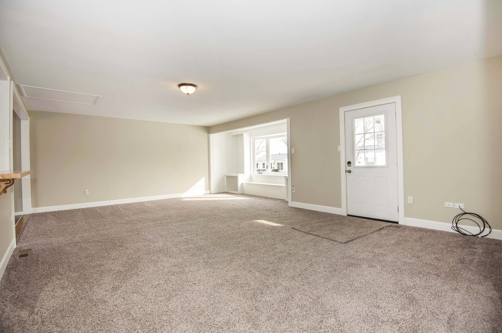 412 Haller Avenue Romeoville, IL 60446 - Photo 4 of 19 a view of an empty room with windows