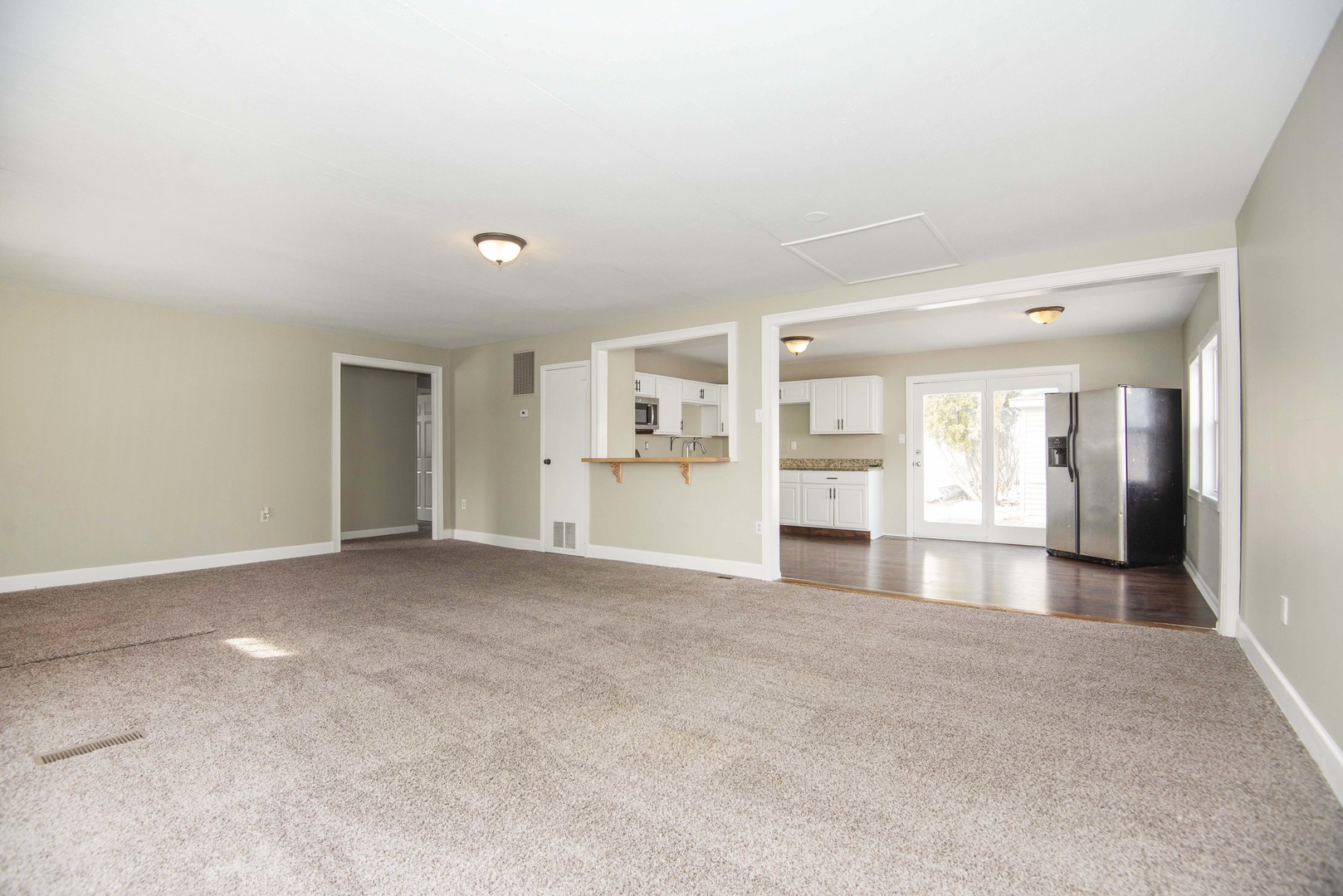 412 Haller Avenue Romeoville, IL 60446 - Photo 6 of 19 a view of empty room with wooden floor and windows
