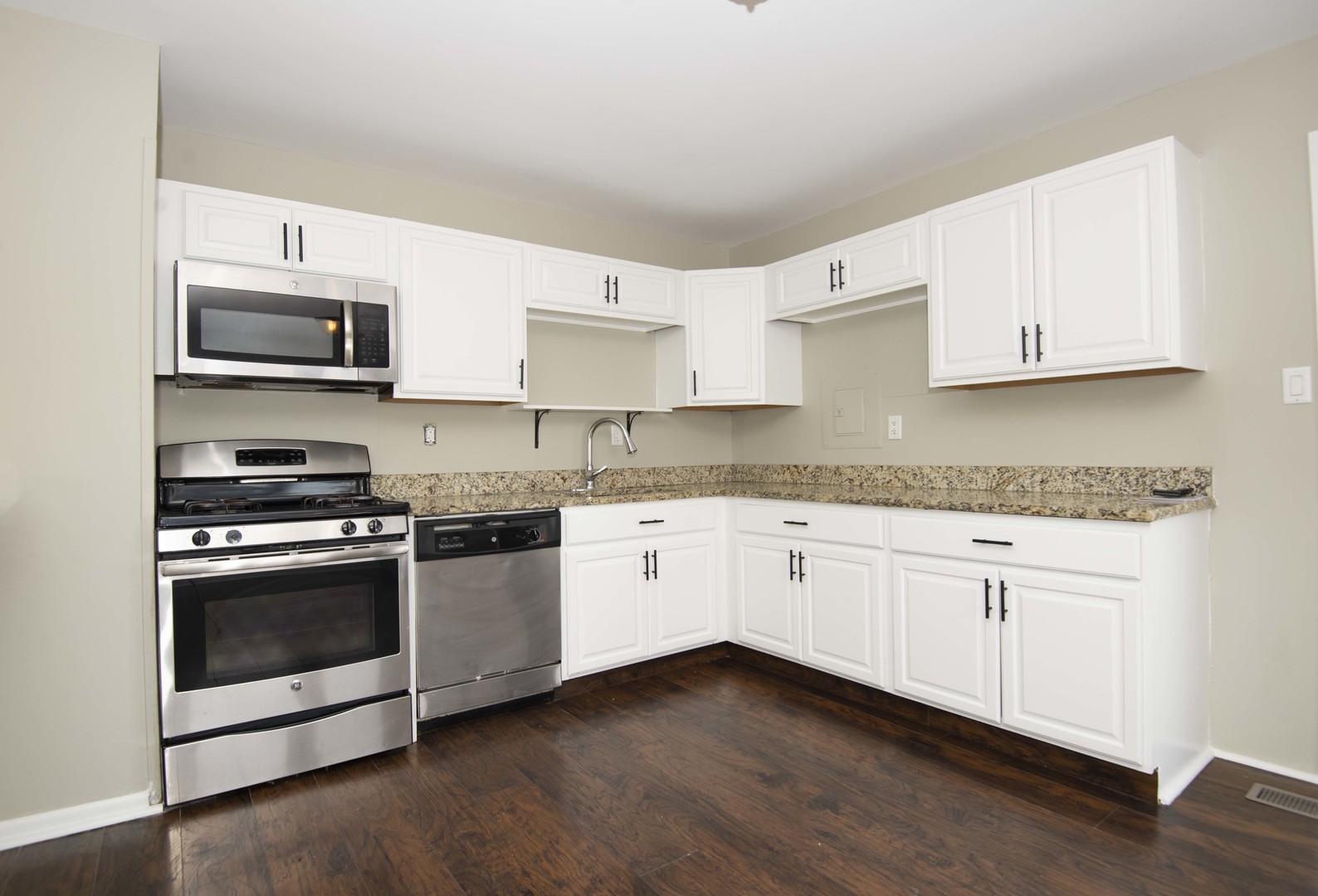 412 Haller Avenue Romeoville, IL 60446 - Photo 9 of 19 a kitchen with stainless steel appliances granite countertop a stove a sink and a microwave