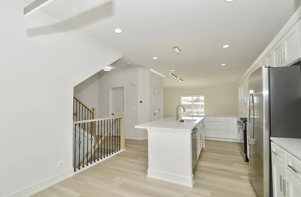 a view of a kitchen from the hallway