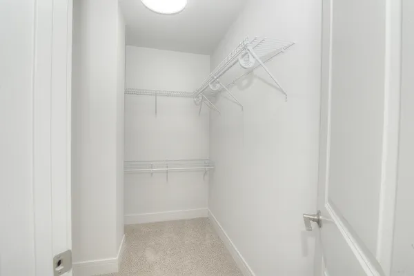 a view of an empty walk in closet