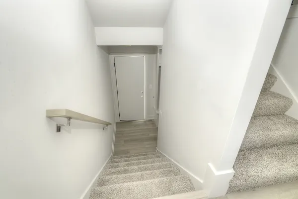 a view of a room with white walls