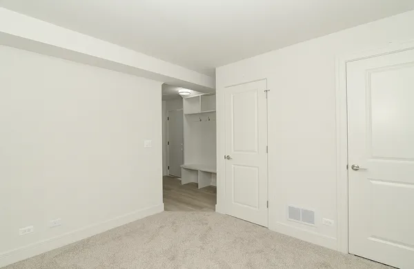 an empty room with a bathroom