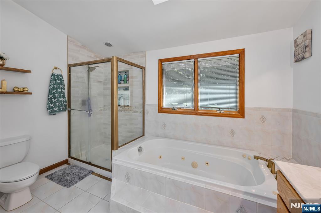 21 Marcia Road Ringwood, NJ 07456 - Photo 19 of 42 a bathroom with a bathtub and a toilet