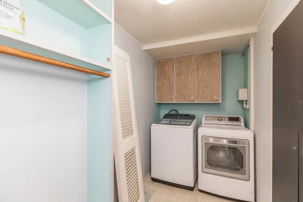 a view of a big room with wooden floor closet and windows