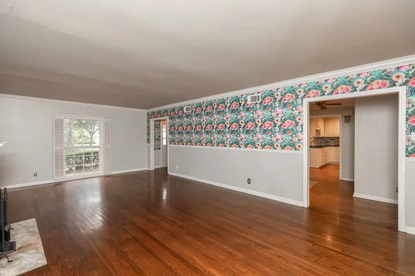 a kitchen with granite countertop a stove oven and a sink with cabinets