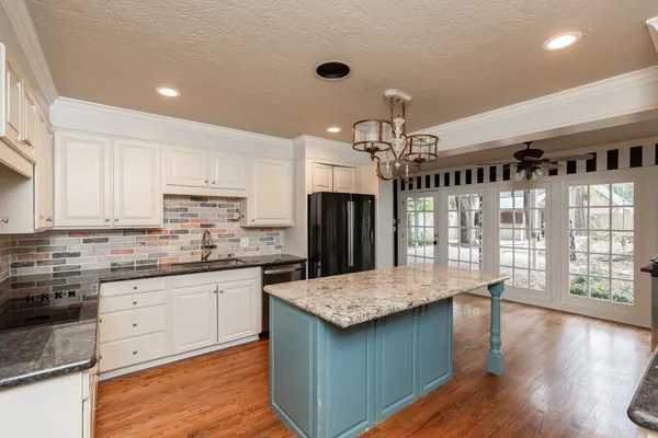 a view of an entryway with wooden floor