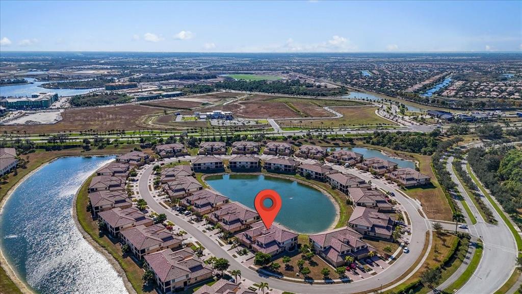 20201 Ragazza Circle, Unit 201 Venice, FL 34293 - Photo 53 of 58 an aerial view of a house with a swimming pool