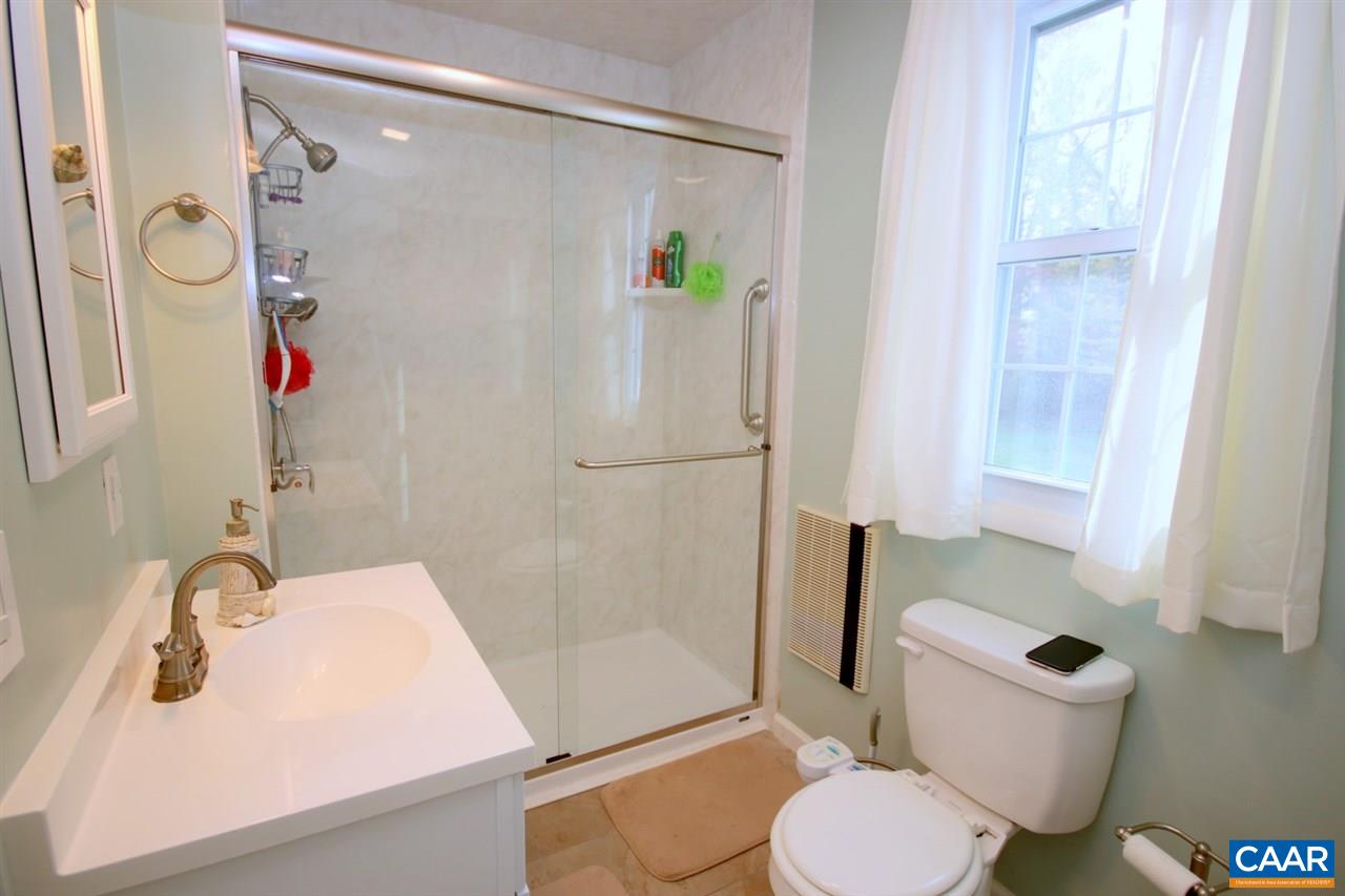 1264 Ridgeview Road Reva, VA 22735 - Photo 16 of 43 a bathroom with a sink toilet and shower