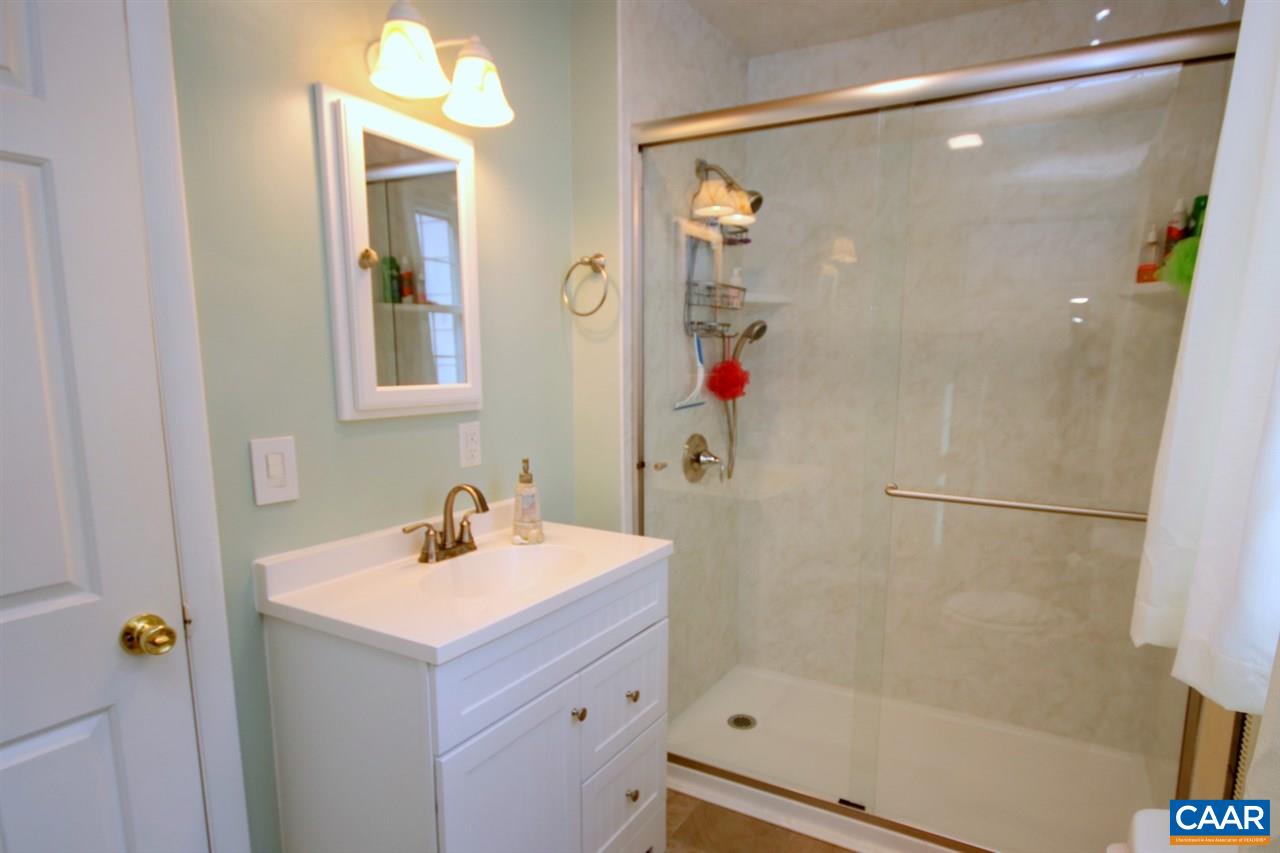 1264 Ridgeview Road Reva, VA 22735 - Photo 17 of 43 a bathroom with a sink and mirror with shower