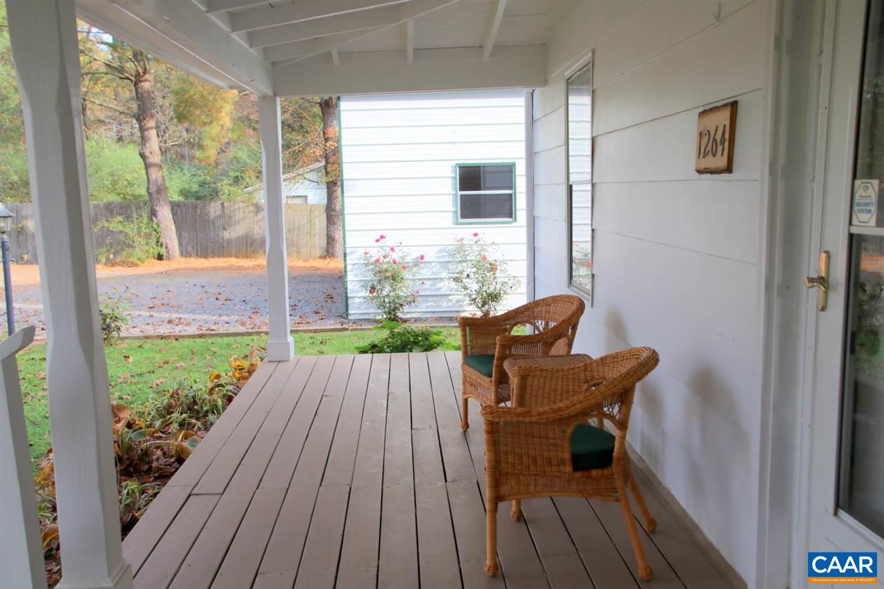 1264 Ridgeview Road Reva, VA 22735 - Photo 38 of 43 a view of a deck with table and chairs and wooden floor