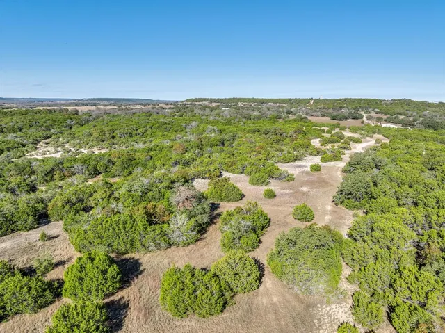 a view of a field with an ocean