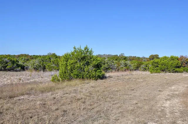 a bathroom with a sink mirror vanity and toilet