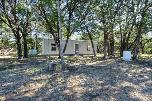 a view of a livingroom with furniture and a chandelier
