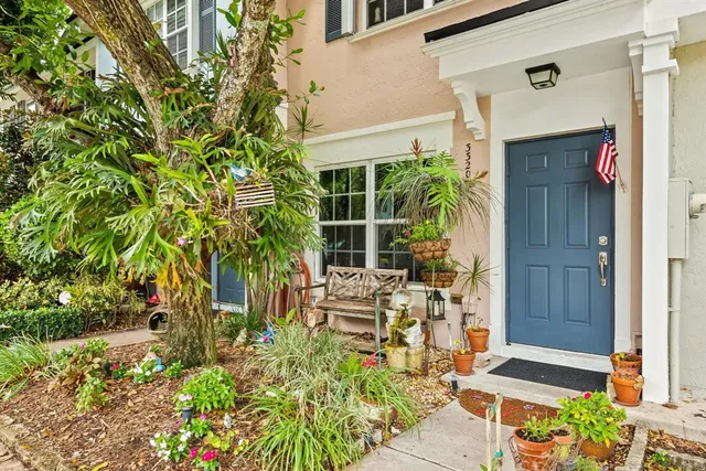 a front view of a house with a garden