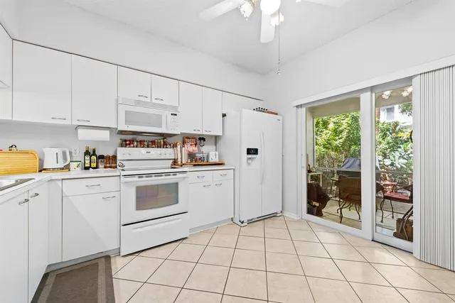 a kitchen with a stove a sink and a refrigerator