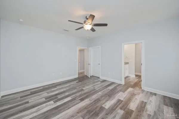 a view of empty room with ceiling fan
